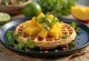 Waffle fusion dengan santan, keju parut, mangga, dan serpihan cabai disajikan