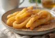 Churros dengan madu, churros cokelat keemasan disajikan dengan saus madu