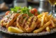 Piring gyros disajikan penuh warna dengan daging, kentang goreng, dan sayuran segar